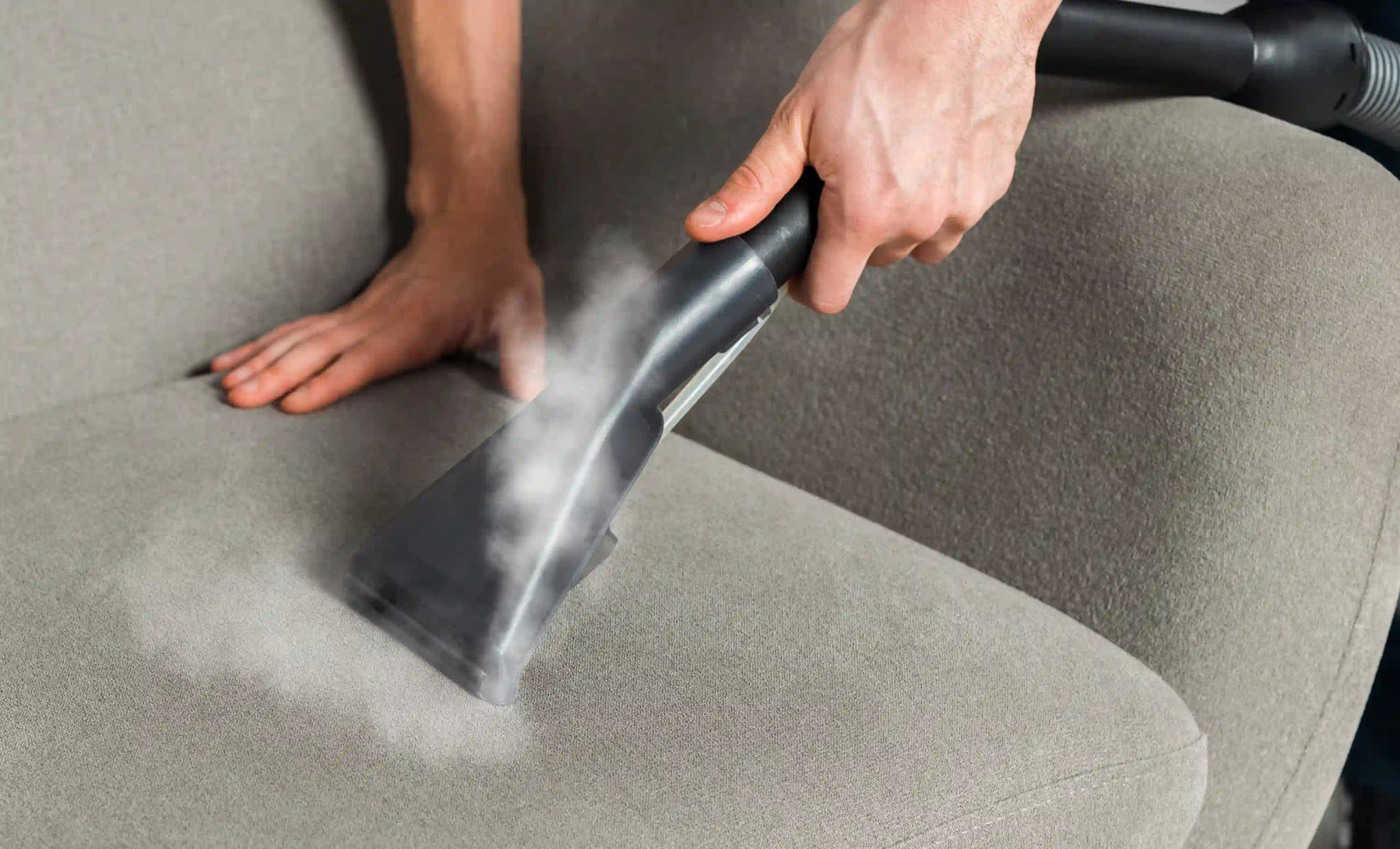 Steam cleaning a couch